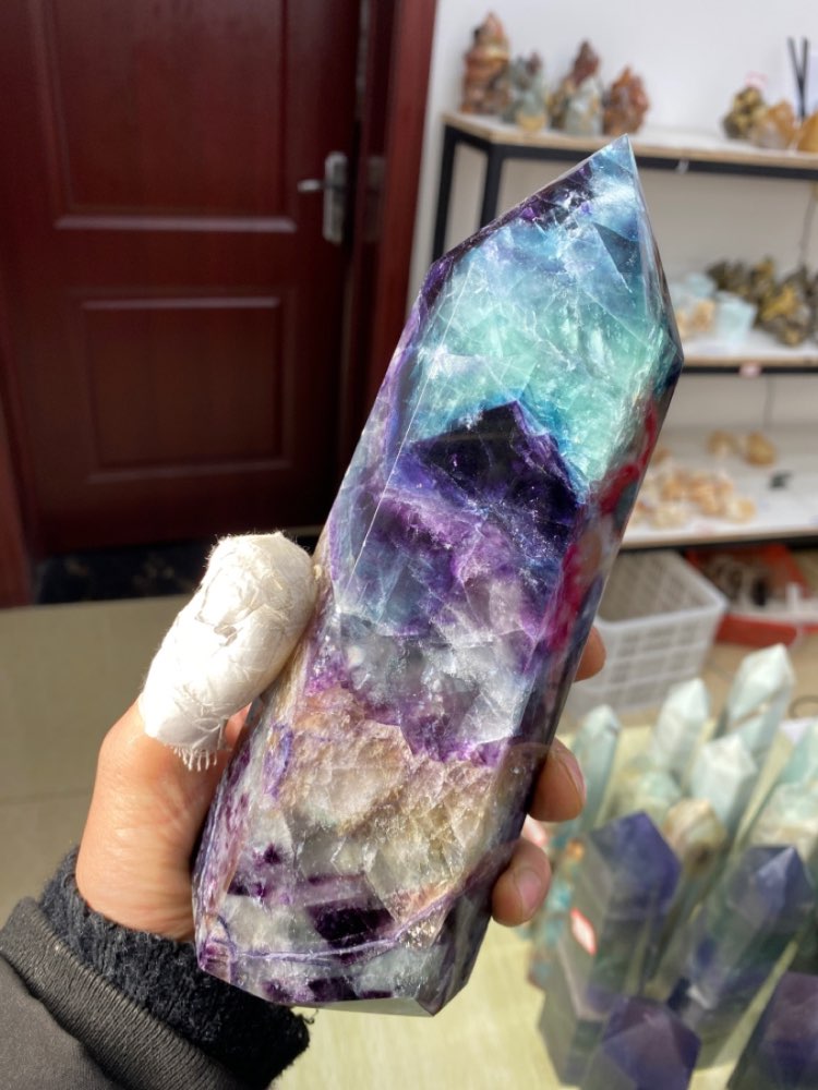 A large natural colored fluorite crystal point natural crystal wand